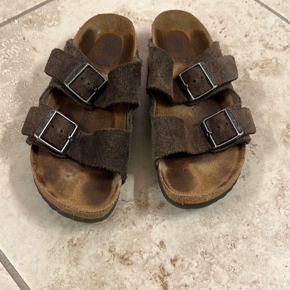Grey suede Birkenstock Arizona sandals.